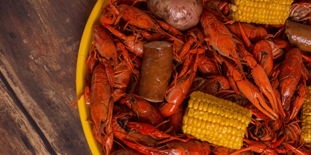 A tray filled with boiled crawfish. 